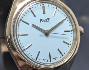 Orologio da uomo vintage PIAGET a carica manuale con 17 rubini e quadrante bianco.