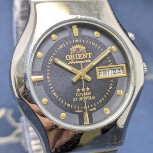 Rare vintage orient automatic day date movement number 46941A Japan made men's watch