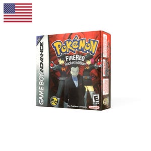 May include: A Game Boy Advance video game box for Pokémon FireRed Rocket Edition. The red box features the Pokémon logo, the title text, and three characters in Team Rocket uniforms. An ESRB E rating icon is visible on the lower right corner.