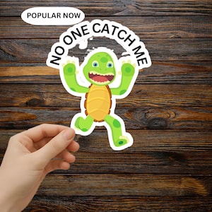 May include: A green and yellow cartoon turtle sticker with the text "NO ONE CATCH ME" in a white arch. The sticker also has the text "POPULAR NOW" in a white oval. The turtle is running with its arms up.