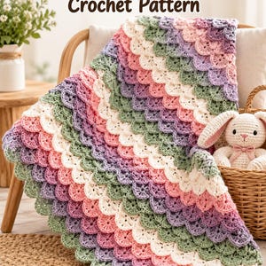 May include: A crochet baby blanket featuring a repeating scale-like pattern in alternating rows of sage green, cream, soft pink, and lavender. The text Dragon Baby Blanket Crochet Pattern is displayed at the top of the image.