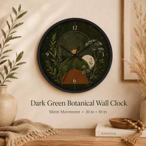 May include: A round wall clock with a black frame and a dark green face featuring botanical illustrations, a sun, and a moon. The clock displays the text Dark Green Botanical Wall Clock, Silent Movement, and the dimensions 10 in x 10 in.