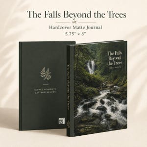 May include: A 14.6 cm by 20.3 cm hardcover matte journal titled The Falls Beyond the Trees. The back cover is dark green with a fern graphic and the text Simple Moments. Lasting Beauty. The front cover features a waterfall and forest scene.