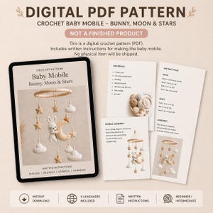 May include: Digital PDF crochet pattern for a baby mobile featuring a bunny, moon, and stars. The pattern includes written instructions in English, German, Spanish, and French. The image shows the pattern on a tablet and printed instructions.