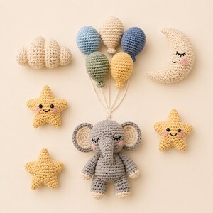 May include: A crochet set featuring a gray elephant holding five colorful balloons in blue, beige, green, and yellow. The set includes a beige cloud, a crescent moon with a face, and three yellow stars with smiling faces and pink cheeks.