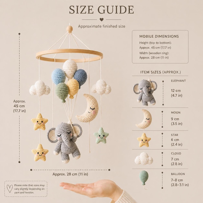 May include: A crochet baby mobile featuring a central gray elephant, a crescent moon, stars, clouds, and balloons suspended from a wooden ring. Text includes SIZE GUIDE, MOBILE DIMENSIONS: Height 17.7 in, Width 11 in, and ITEM SIZES (APPROX.) with measurements in inches.
