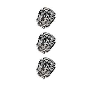 May include: Three identical black and white embroidered patches featuring a central skull design with wings. The text VOLBEAT is arched at the top, and ESTO. 2001 is printed at the bottom. Each patch has a shield-like shape with star accents.