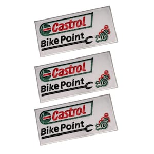 May include: Three white rectangular embroidered patches with the text "Castrol Bike Point" in black and red. Each patch features a green and red logo and a motorcycle graphic.