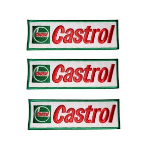 May include: Three embroidered Castrol logo patches. Each patch has a white background with a green border. The Castrol logo is in the upper left corner, and the word "Castrol" is in red, stylized lettering.
