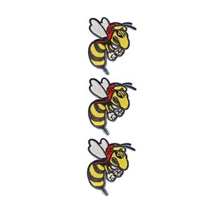 May include: Three identical embroidered patches featuring a yellow and black striped wasp with a red head, white wings, and a fierce expression. Each patch displays a detailed stitched design of the insect in a flying position with its stinger pointed downward.