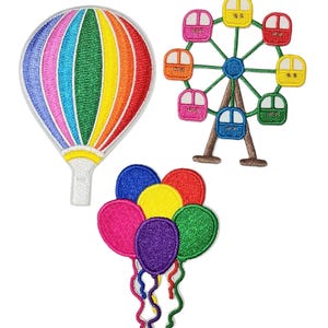 May include: Embroidered patches featuring a colorful hot air balloon, a Ferris wheel, and a cluster of balloons. The hot air balloon has rainbow stripes. The Ferris wheel has colorful cars. The balloons are in various colors.