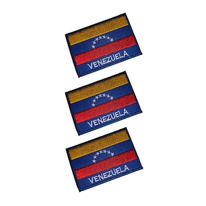 May include: Three embroidered patches featuring the flag of Venezuela. Each patch has a blue border, a yellow top section, a red middle section, and a blue bottom section. The word "VENEZUELA" is embroidered in white on the red section.