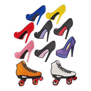 May include: A collection of embroidered patches featuring seven high-heeled shoes in blue, yellow, red, black, pink, and purple, alongside two roller skates in orange and white with black laces and red wheels, all arranged on a white background.