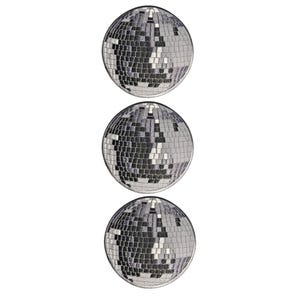 May include: Three circular embroidered patches, each featuring a disco ball design. The patches are rendered in shades of silver, gray, and black, with a grid-like pattern of square segments that mimic the reflective surface of a disco ball.