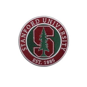 May include: A circular embroidered patch featuring the Stanford University seal. The design includes a red letter S with a green pine tree silhouette, surrounded by a red border with the white text Stanford University and Est. 1885.