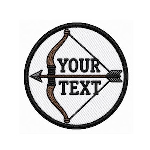 May include: Embroidered patch featuring a brown bow and arrow design within a white circle, framed by a black border. The text "YOUR TEXT" is centered within the design, ideal for customization. The patch is suitable for apparel and accessories.