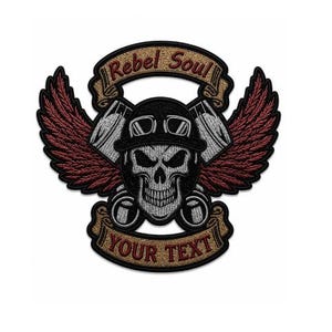 May include: Embroidered patch featuring a skull wearing a helmet and goggles, with wings and engine pistons. The patch has banners with the text "Rebel Soul" and "YOUR TEXT". The wings are burgundy, and the skull is gray and white.