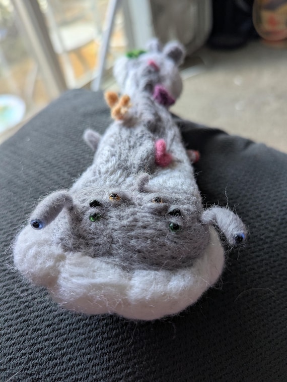 Needle-felted cryptids are a genuinely labor-intensive handmade art form — this one sits at the crossroads of Bigfoot lore and fine textile craft.