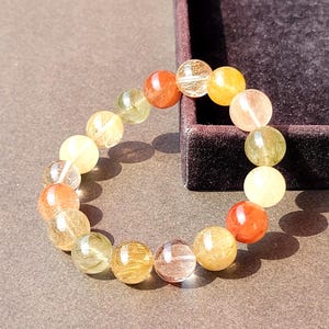 Armband met meerdere rutielkwarts kralen 12 mm, natuurlijke Braziliaanse regenboogrutielkralen, grote gouden, rode en koperkleurige kristallen haarsieraad, geluksgeschenk