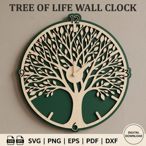 May include: A circular wall clock featuring a light wood laser-cut tree of life design layered over a dark green background. The clock face displays the numbers 12, 3, 6, and 9 in a bold font, with two clock hands centered on the tree trunk.