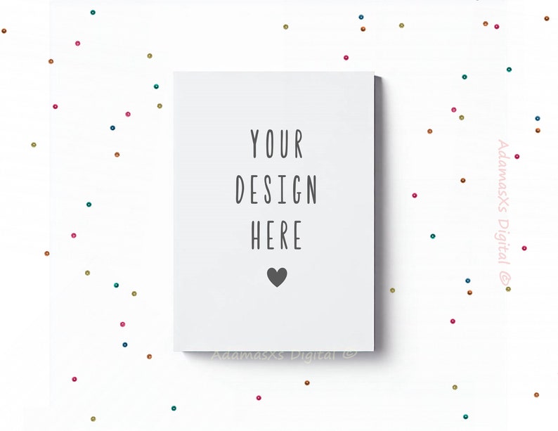 May include: White card with the text "YOUR DESIGN HERE" and a small black heart. The card is on a white background with scattered colorful dots.