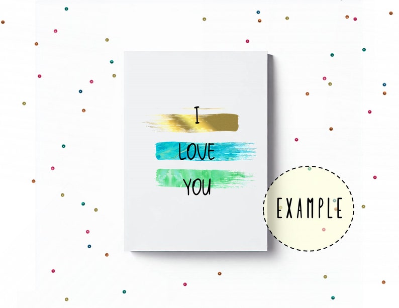 May include: A white card with the words "I love you" written in black. The words are layered over three horizontal brushstrokes in gold, blue, and green.