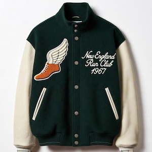 May include: A dark green varsity jacket with cream-colored sleeves, featuring a stand-up collar and snap-button closure. An orange winged shoe patch is on the right chest, and the text New England Run Club 1967 is embroidered on the left chest.