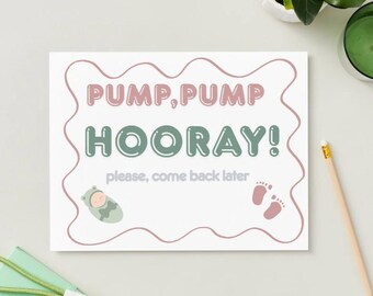 May include: A white card with the text "PUMP, PUMP HOORAY!" in pink and green bubble letters. The card also features a baby in a hooded outfit and baby footprints. The text "please, come back later" is also included.