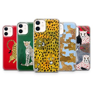 May include: Five smartphone cases featuring various leopard and cheetah illustrations. The designs include a red case with a single leopard, a green case with a cheetah, a yellow case with multiple cheetah faces, a blue case with a cheetah pattern, and a multi-coloured case with several cheetahs.