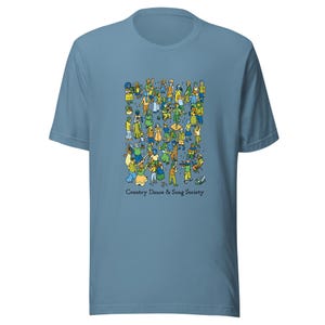 Puede incluir: Camiseta azul claro con una colorida ilustración de una multitud de personas bailando. El gráfico incluye figuras con varios atuendos, con el texto "Country Dance & Song Society" debajo.