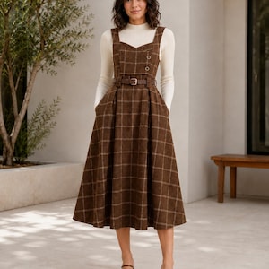 brown plaid overall dress the piece features button