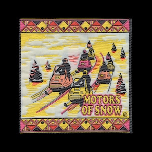 May include: A square embroidered patch featuring a winter scene with multiple snowmobiles traveling across a yellow and white landscape. The text MOTORS OF SNOW is stitched in yellow with a pink outline. The border has a geometric diamond pattern.