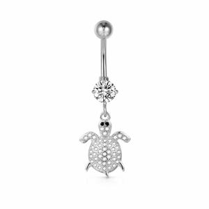 May include: A silver belly button ring with a clear gemstone and a turtle charm. The turtle is covered in small, clear stones and has black eyes. The top of the ring has a small, round ball. The ring is designed for body piercing.