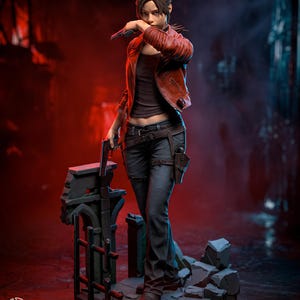 May include: A detailed figurine of a character with brown hair wearing a red leather jacket, a dark brown top, and dark gray pants. The character holds a handgun in one hand and is positioned on a base of gray stone rubble. A small logo with the text H3LL CREATOR is visible in the bottom left corner.