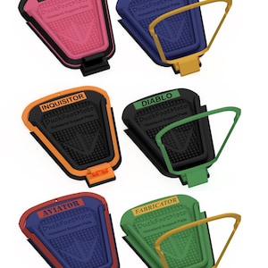 May include: Six DuckFootMoto kickstand support plates in various colours including pink, blue, orange, green, and red. Each plate features a textured surface, a central logo, and a specific name label like Panther, Captian, Inquisitor, Diablo, Aviator, or Fabricator.