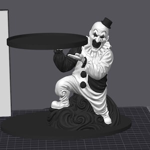 May include: A 3D rendered figurine of a clown character wearing a white and black costume with a ruffled collar and a small top hat. The clown is in a kneeling position on a swirling base, holding a flat, circular black tray above its head.