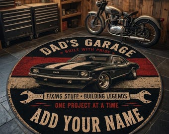 May include: A round rug featuring a black vintage muscle car, the text DAD'S GARAGE BUILT WITH PRIDE, FIXING STUFF BUILDING LEGENDS ONE PROJECT AT A TIME, ADD YOUR NAME, and EST. 2024. The design includes a red horizontal stripe and two wrenches.