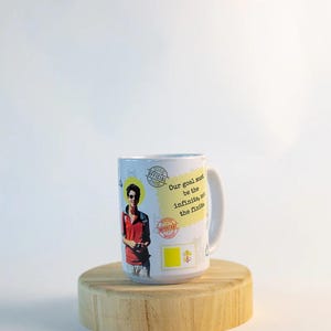 May include: A set of three ceramic mugs with a speckled, matte finish. The mugs are in cream, light grey, and dark grey. Each mug has a simple, minimalist design, ideal for coffee or tea.