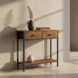 May include: A rectangular console table with a dark metal frame and two wooden drawers featuring black knobs. The table includes a lower shelf, a dark vase with a dried plant, and a stack of books on the top surface, plus a small white vase below.
