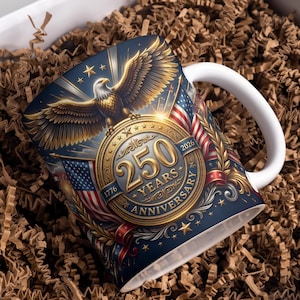May include: White ceramic mug featuring a detailed design celebrating a 250-year anniversary. The design includes a golden eagle, American flags, stars, and the text "250 YEARS ANNIVERSARY 1776-2026". The mug has a white handle and is set in a gift box.