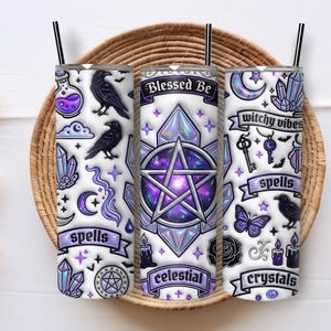 May include: Three white insulated tumblers with black straws, featuring celestial and witchy designs. The designs include ravens, crystals, moons, stars, pentagrams, and the phrases "Blessed Be", "spells", "celestial", "witchy vibes", and "crystals".