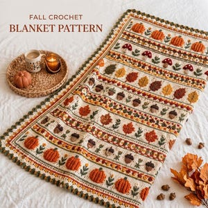 May include: A crochet blanket featuring a repeating pattern of orange pumpkins, red and white mushrooms, brown acorns, and multicolored autumn leaves on a cream background, with the text FALL CROCHET BLANKET PATTERN printed at the top.
