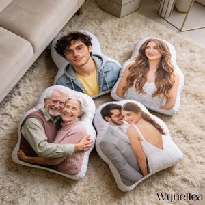 May include: Four custom-shaped pillows with printed photographs of people. The pillows feature images of a young man, a young woman, an older couple, and a couple in formal attire. The pillows are on a white rug.