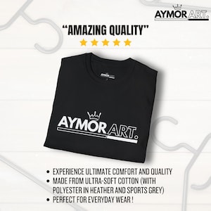 May include: A black t-shirt featuring a white graphic logo that reads AYMOR ART with a crown icon above the text. The shirt is displayed with text above that reads AMAZING QUALITY with five yellow stars and bullet points below the shirt.
