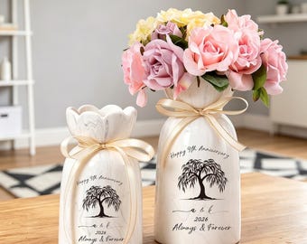 May include: Two white marble-patterned ceramic vases with scalloped rims, each tied with a beige ribbon. The vases feature a black printed willow tree graphic, the text Happy 9th Anniversary, a & k, 2026, and Always & Forever. One vase holds pink and yellow roses.