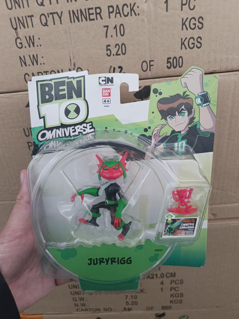 May include: A Ben 10 Omniverse action figure of Juryrigg in a clear plastic package. The figure is red, green, and black. The packaging features the Ben 10 logo, a cartoon image of Ben, and the text "Omnitrix Challenge".