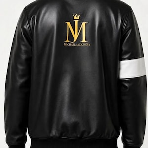 May include: Black leather bomber jacket with a gold "MJ" logo and crown on the back, with the words "MICHAEL JACKSON" below. The jacket has a white stripe on the left sleeve.