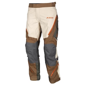 May include: Tan and brown motorcycle pants with orange accents and the Klim logo. The pants have reinforced panels on the knees and thighs, and multiple pockets. The pants have a brown waistband with a buckle closure.