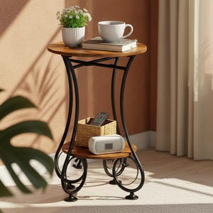 May include: A small, decorative side table with a round, wooden top and a lower shelf. The table has a black metal frame with curved legs. A white coffee cup, a small potted plant, and a book sit on top. A woven basket, a remote, and a speaker are on the lower shelf.