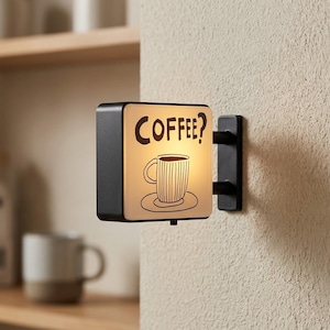 May include: A set of three ceramic mugs with a speckled, matte finish. The mugs are in shades of cream, light gray, and dark gray. Each mug has a simple, minimalist design, perfect for coffee or tea.